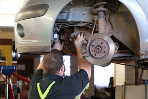 Mechanic working at a wheel hub