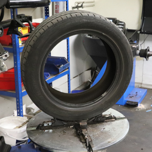 A tyre on the tyre changing machine